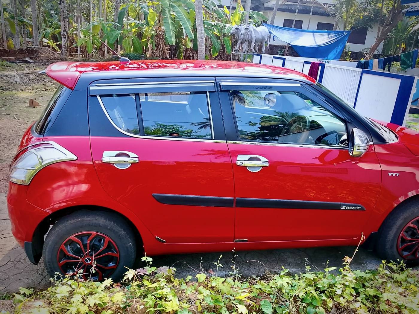 Maruti Suzuki Swift red side view