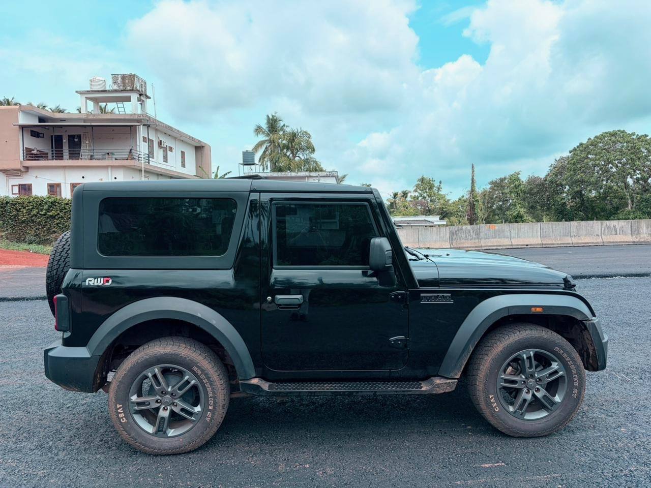 Mahindra Thar RWD black side profile, self drive rental Kannur