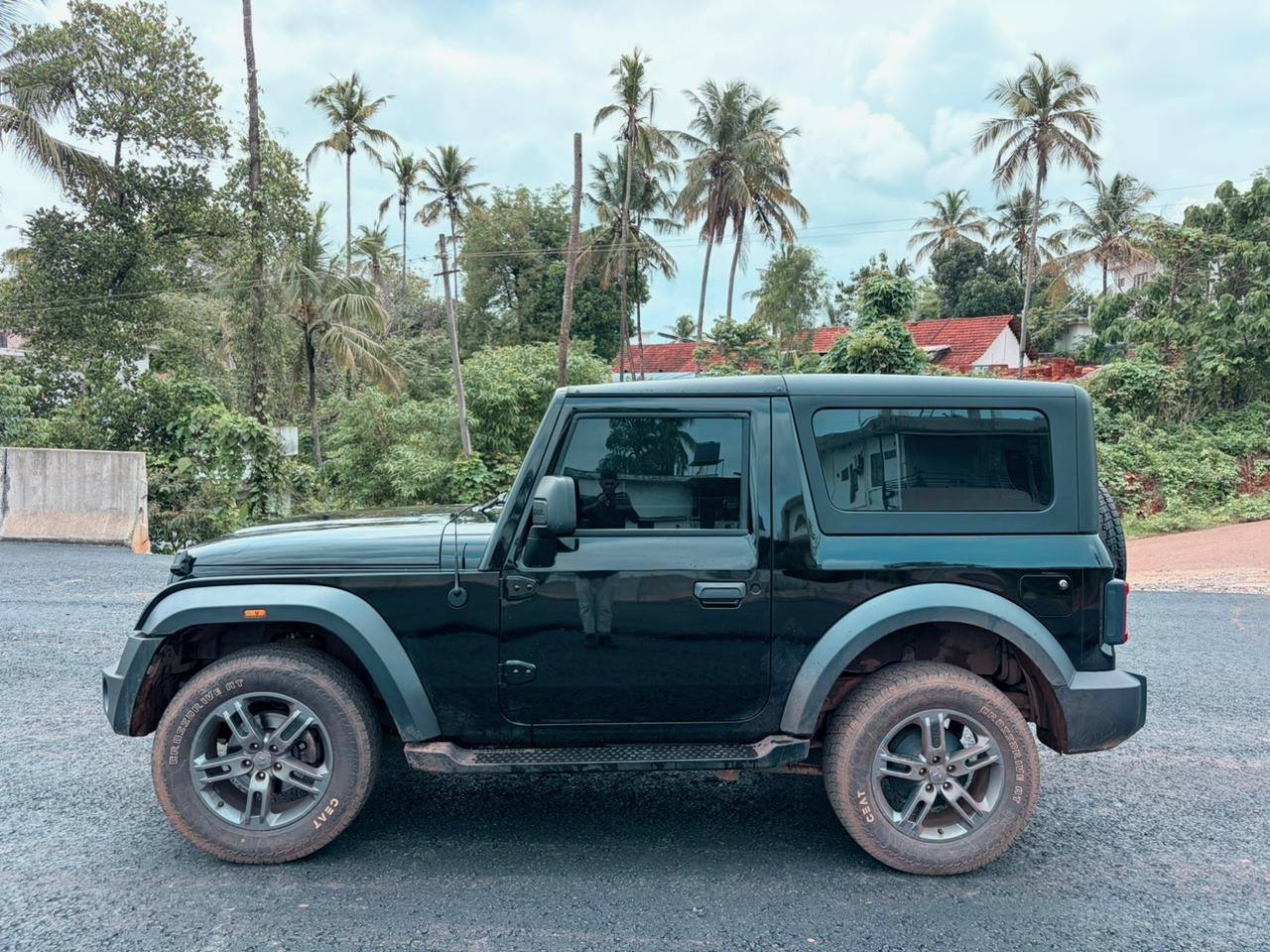 Mahindra Thar side profile near greenery